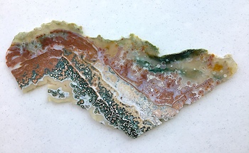 Translucent hyper-heterogeneous type polished slab cut by Madagascar Minerals, length ~14in