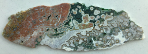 Hyper-heterogeneous slab from Vein 1/2 with mixed translucent and crystalline quartz areas, cut by ORCA, ~14in wide