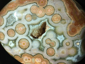 Figure 4: Interior view of two specimens of Ocean Jasper, Kabamby and Marovato (shown here). These show the common quartz druzy growth on top of botryoidal chalcedony forms. Lieber's Fig. 4 is of a similar Kabamby specimen. Specimen widths: ~60mm (Marovato, shown here). 