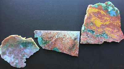 'Foot Span': Three specimens that I collected from different sources. It appears that these three might be interconnected as shown, with transitions between translucent, semitranslucent and opaque areas. By using such a 'mapping' analysis tool, it is possible to reconstruct large areas of the mined deposits from Marovato Deposit/veins 1/2, that show the 'hyper-heterogeneous' complexity inherent in this material. These three specimens span a length of ~12 in.